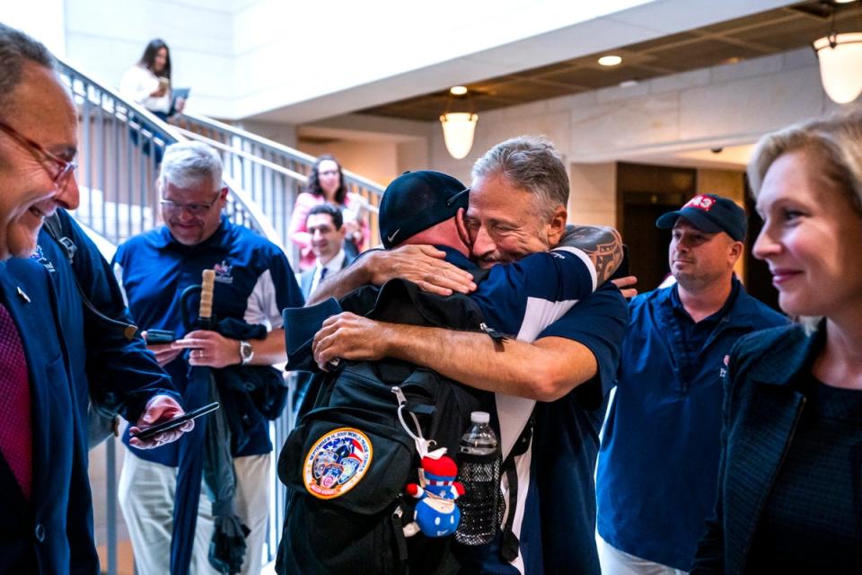 Jon Stewart and John Feal hug after the Senate passes the 9/11 Compensation fund in 2019 (EPA)