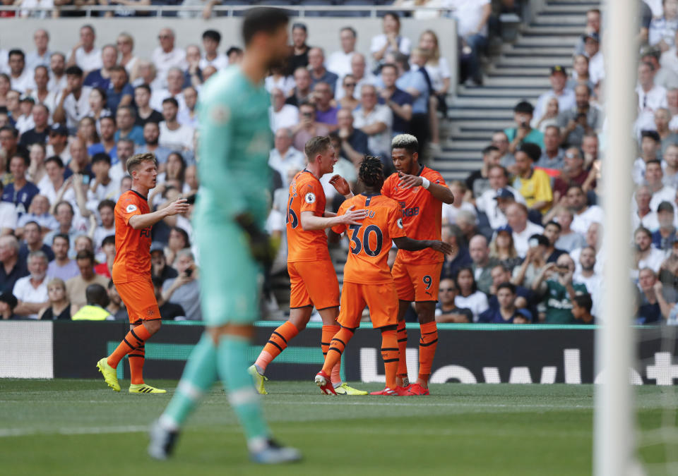 Newcastle's Joelinton, right, celebrates after scoring his side's first goal during the English Premier League soccer match between Tottenham Hotspur and Newcastle United at Tottenham Hotspur Stadium in London, Sunday, Aug. 25, 2019.(AP Photo/Frank Augstein)