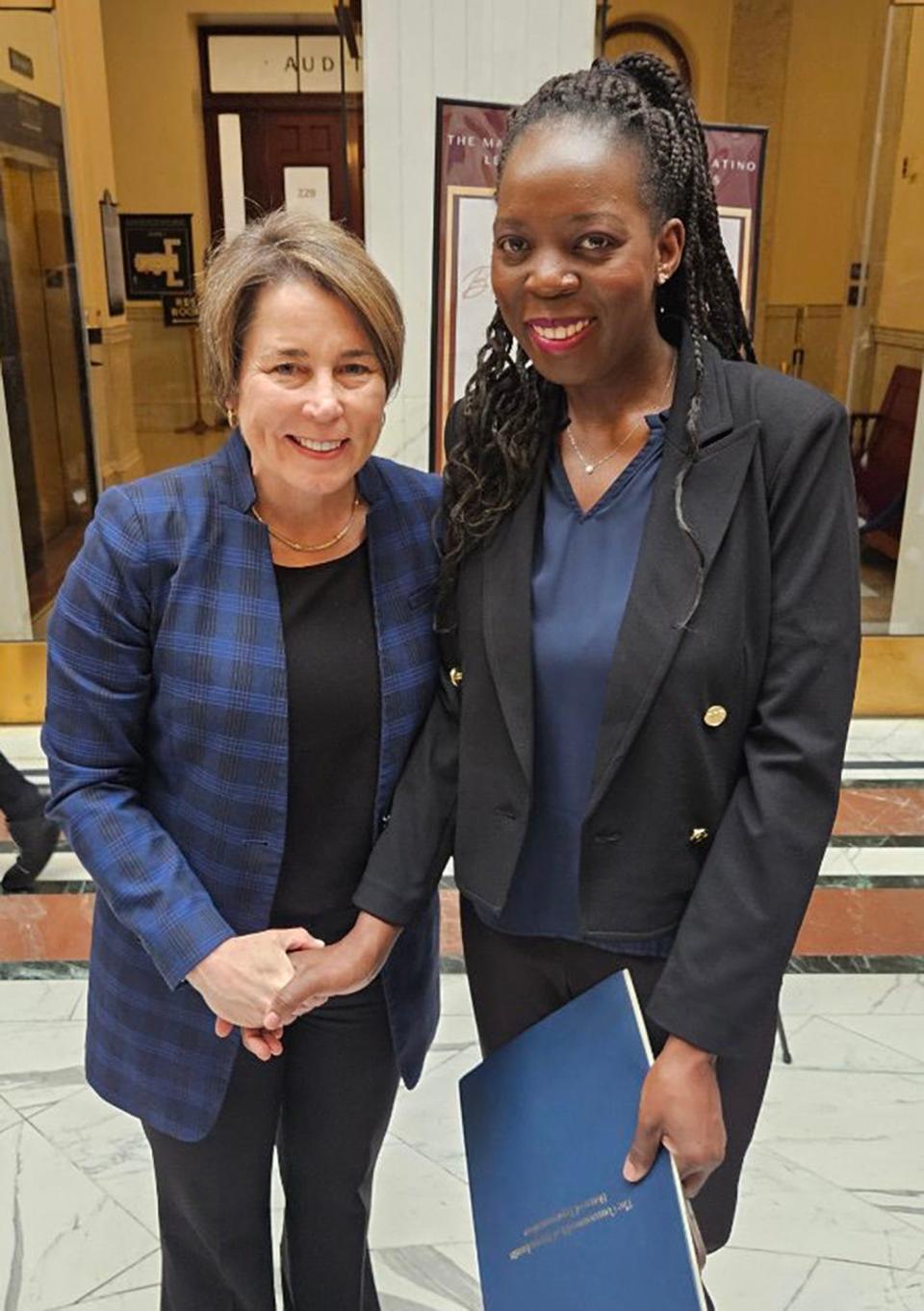 Norah Zoummar, right, co-owner of 33 All American Diner in Ashland, poses with Gov. Maura Healey at the State House after being presented with a Black Excellence Award, which is sponsored by the Massachusetts Black and Latino Legislative Caucus. A Ugandan singer, Zoummar raises money to support women and children in her home village of Namwendwa.