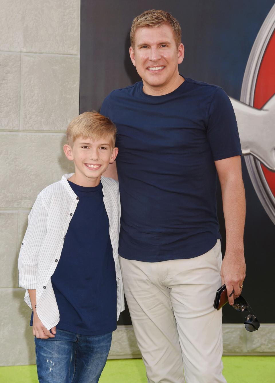 Todd Chrisley (R) and son Grayson Chrisley arrive at the Premiere of Sony Pictures' 'Ghostbusters' at TCL Chinese Theatre on July 9, 2016 in Hollywood, California