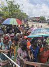 People line up to vote in Buka, the Autonomous Region of Bougainville, Papua New Guinea, Saturday, Nov. 23, 2019, in a historic referendum to decide if they want to become the world's newest nation by gaining independence from Papua New Guinea. (Post Courier via AP)