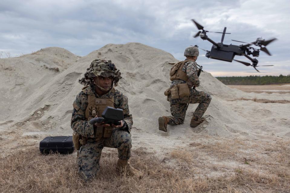 Marine Corps Lance Cpl. Donte Mathews flies an unmanned aircraft system during a mortar range event at Camp Lejeune, N.C., Jan. 17, 2023.