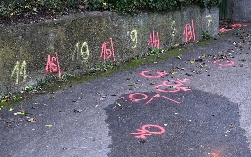 Police forensics markers at the scene where two girls was attacked on their way to school - DPA