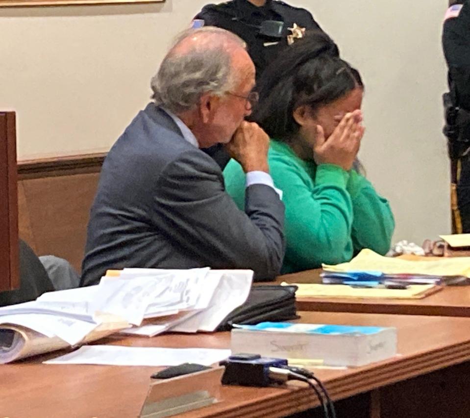 Yokauri Batista-Alcantara cries as family and friends offer words of support during her sentencing Wednesday before Middlesex County Superior Court Judge Benjamin Bucca.
