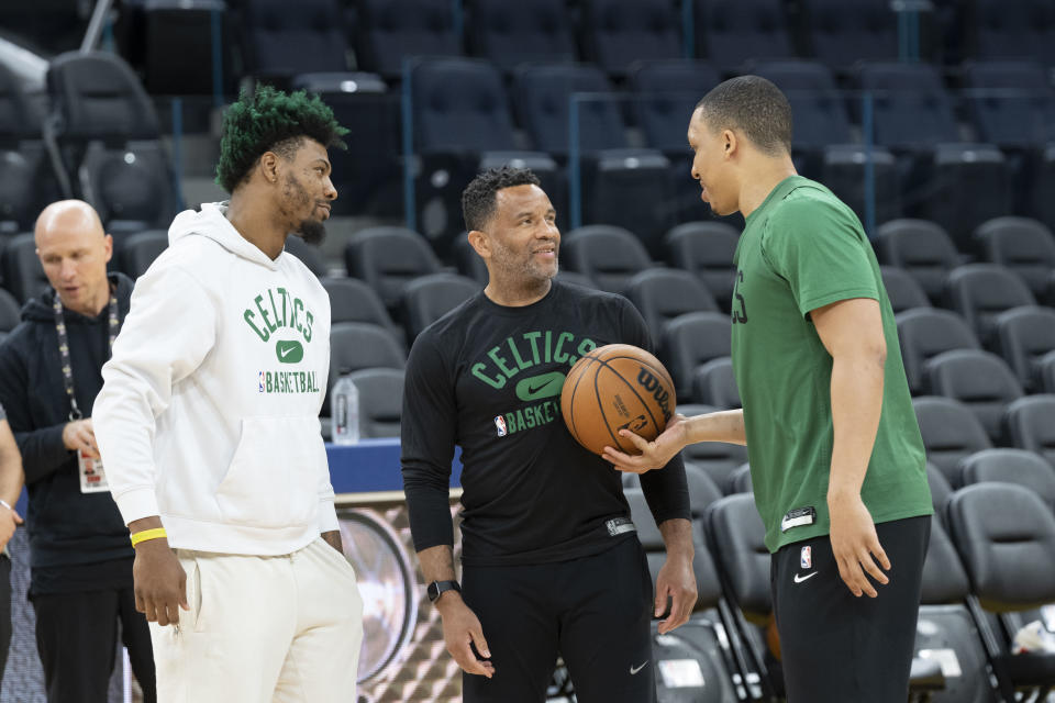 Boston Celtics guard Marcus Smart (left), assistant coach Damon Stoudamire (center) and forward Grant Williams (right) talk during media day for the 2022 NBA Finals at Chase Center in San Francisco on June 1, 2022. (Kyle Terada/USA TODAY Sports)