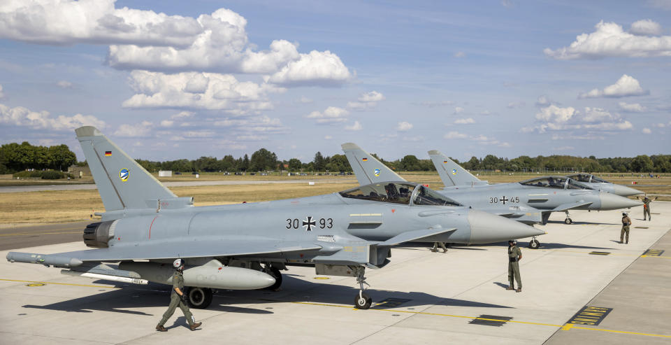 German Eurofighters get ready for takeoff at Neuburg Air Base in Neuburg An Der Donau, Germany, Monday Aug. 15, 2022. A group of German air force fighter jets neared Singapore on Tuesday, Aug. 16, 2022, in a marathon bid to fly them some 12,800 kilometers (8,000 miles) from their home base to Southeast Asia in just 24 hours. (Daniel Karmann/dpa via AP)