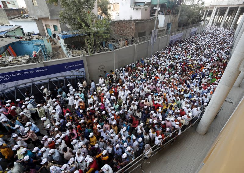 People leave the Sardar Patel Stadium after U.S. President Donald Trump and Indian Prime Minister Narendra Modi addressed a "Namaste Trump" event in Ahmedabad