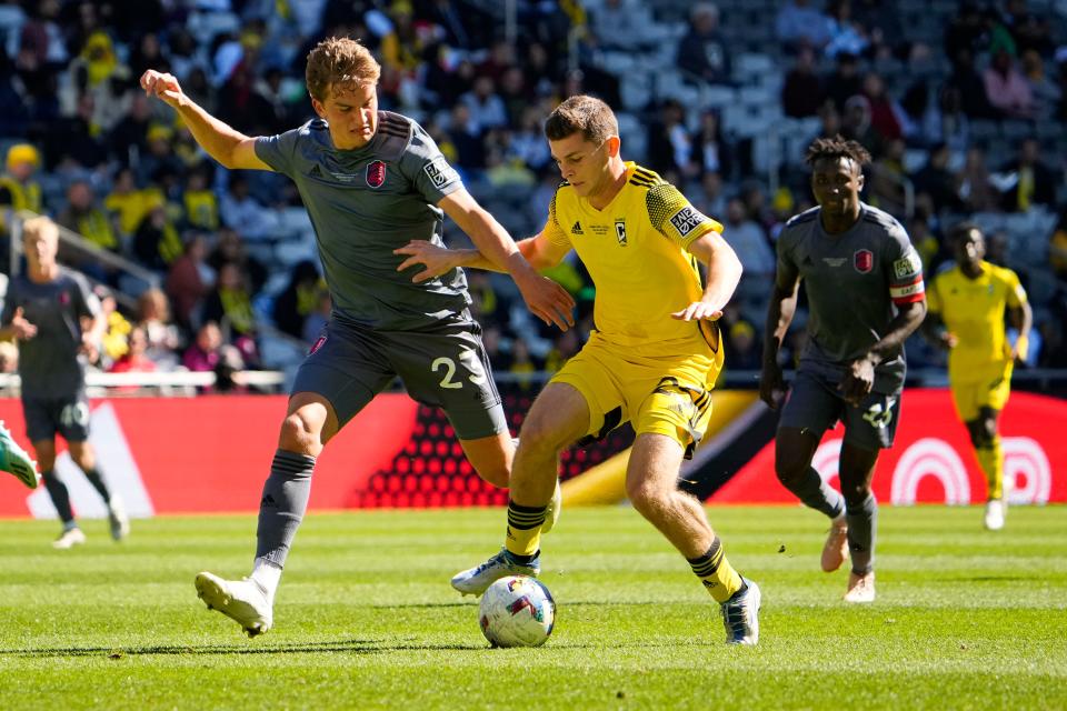 Oct 8, 2022; Columbus, Ohio, USA; Columbus Crew 2 Sean Zawadzki (25) dribbles past St. Louis CITY2 Max Schneider (23) during the first half of the MLS NEXT Pro Cup Championship at Lower.com Field. Mandatory Credit: Adam Cairns-The Columbus Dispatch