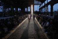 Models wear creations as part of the Ermenegildo Zegna men's Spring-Summer 2020 collection, unveiled during the fashion week, in Milan, Italy, Friday, June 14, 2019. (AP Photo/Luca Bruno)