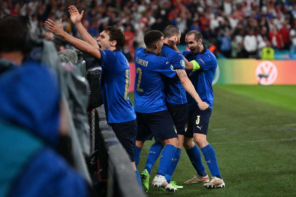 Italy's defender Leonardo Bonucci (2R) celebrates with Italy's defender Giorgio Chiellini (R) after scoring the team's first goal during the UEFA EURO 2020 final football match between Italy and England at the Wembley Stadium in London on July 11, 2021. (Photo by Paul ELLIS / POOL / AFP) (Photo by PAUL ELLIS/POOL/AFP via Getty Images)