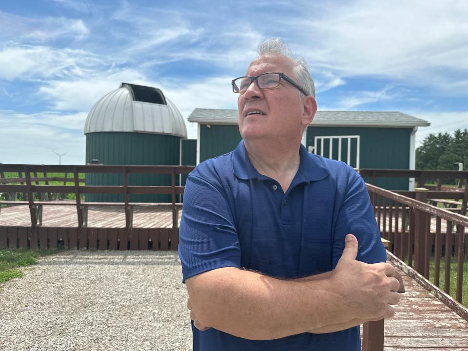 Astronomer Steve Pellarin stands outside the Hallam Observatory near Comber, Ont. 