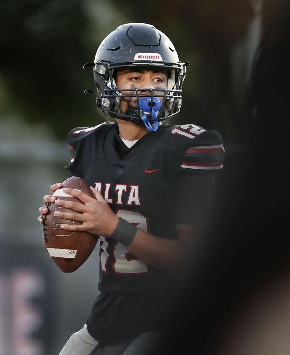 Alta quarterback Tevita Niumeitolu looks to pass as Brighton High School and Alta High School compete in a Week 8 football showdown at Alta High in Sandy on Friday, Sept. 29, 2023. | Laura Seitz, Deseret News