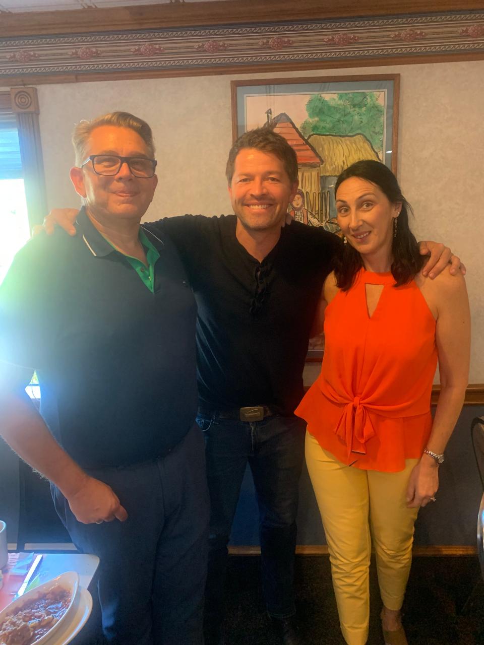 Belgrade Gardens owner Milos Papich, left, and his wife Maja catch a moment with "Roadfood" host Misha Collins at their Barberton restaurant.