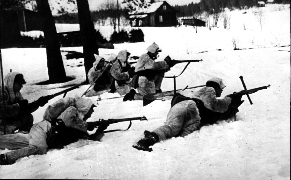 17th October 1939:  Wearing white clothing as camouflage these Finnish troops are on outpost duty on the Finnish-Russian front.  (Photo by Hulton Archive/Getty Images)