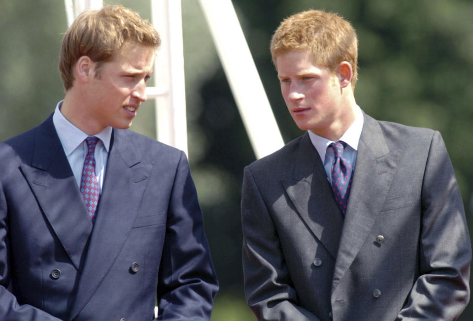 FILE - In this Tuesday, July 6, 2004 file photo, Britain's Princes William, left, and Harry talk at the opening of a fountain built in memory of their mother, the late Princess of Wales, in London's Hyde Park. Princess Diana’s little boy, the devil-may-care red-haired prince with the charming smile is about to become a father. The arrival of the first child for Prince Harry and his wife Meghan will complete the transformation of Harry from troubled teen to family man, from source of concern to source of national pride. (Arthur Edwards, Pool Photo via AP, File)