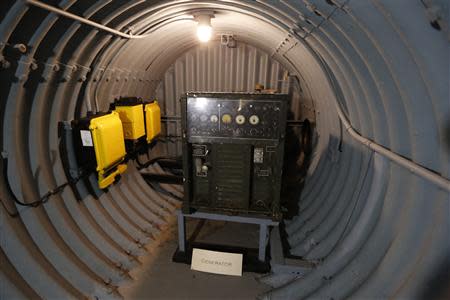 A hallway is shown with a generator at the far end in the cold-war era nuclear fallout shelter constructed for U.S. President John F. Kennedy on Peanut Island near Riviera Beach, Florida November 8, 2013. REUTERS/Joe Skipper