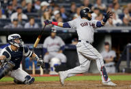 FILE - In this Oct. 9, 2017, file photo, Cleveland Indians' Carlos Santana (41) connects for a two-run home run against the New York Yankees during the fourth inning in Game 4 of baseball's American League Division Series, in New York. Edwin Encarnacion has been traded to Seattle and first baseman Carlos Santana has returned to the Indians in a three-team deal that also involved Tampa Bay. The Rays got infielder Yandy Diaz and minor league right-hander Cole Slusser from Cleveland. The Indians also acquired first baseman Jake Bauers. The swap came Thursday, Dec. 13, 2018, at the close of the winter meetings. (AP Photo/Kathy Willens, File)