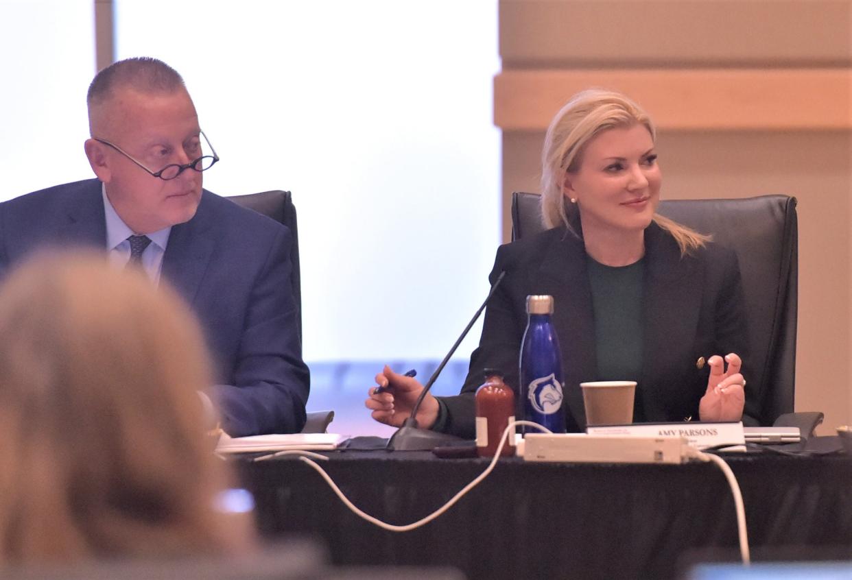 New Colorado State University President Amy Parsons, right, listens to a campus report while seated next to CSU-Pueblo President Timothy Mottet during a break in the CSU System Board of Governors meeting Thursday on the university's campus in Pueblo.