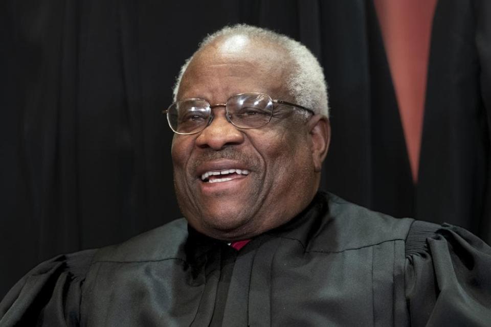 In this Nov. 30, 2018 photo, Supreme Court Associate Justice Clarence Thomas sits for a group portrait at the Supreme Court Building in Washington. (AP Photo/J. Scott Applewhite, File)