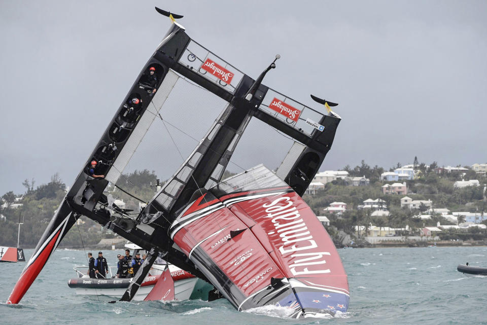 <p>In this photo provided by America’s Cup Event Authority, Emirates Team New Zealand capsizes during an America’s Cup challenger semifinal against Great Britain’s Land Rover BAR on the Great Sound in Bermuda on Tuesday, June 6, 2017. (Ricardo Pinto/ACEA via AP) </p>