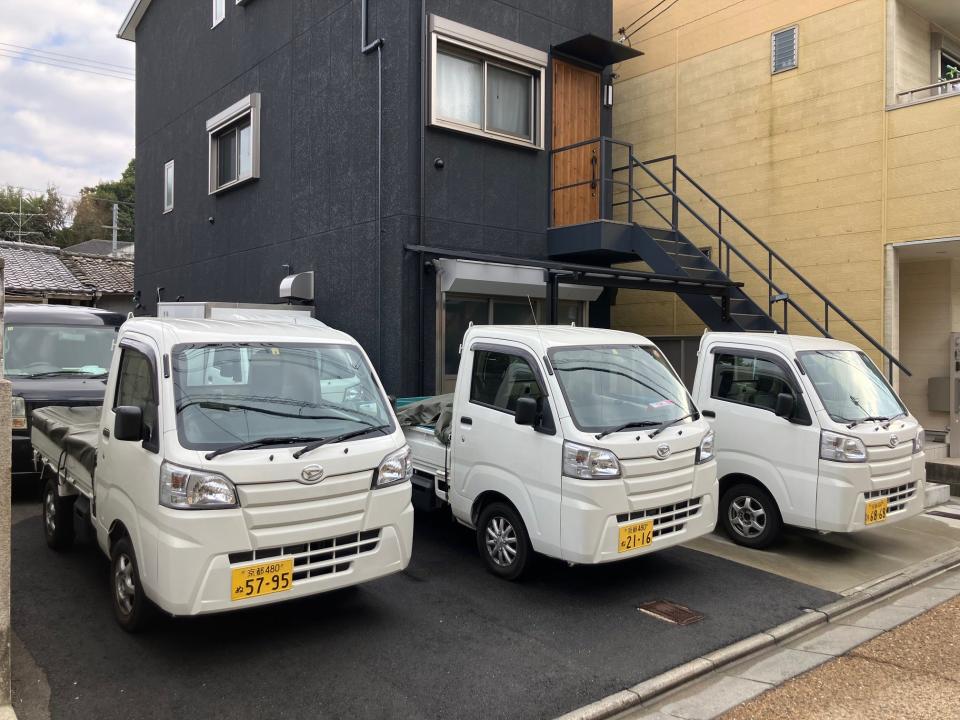 Daihatsu Hijet kei trucks parked side by side in Japan