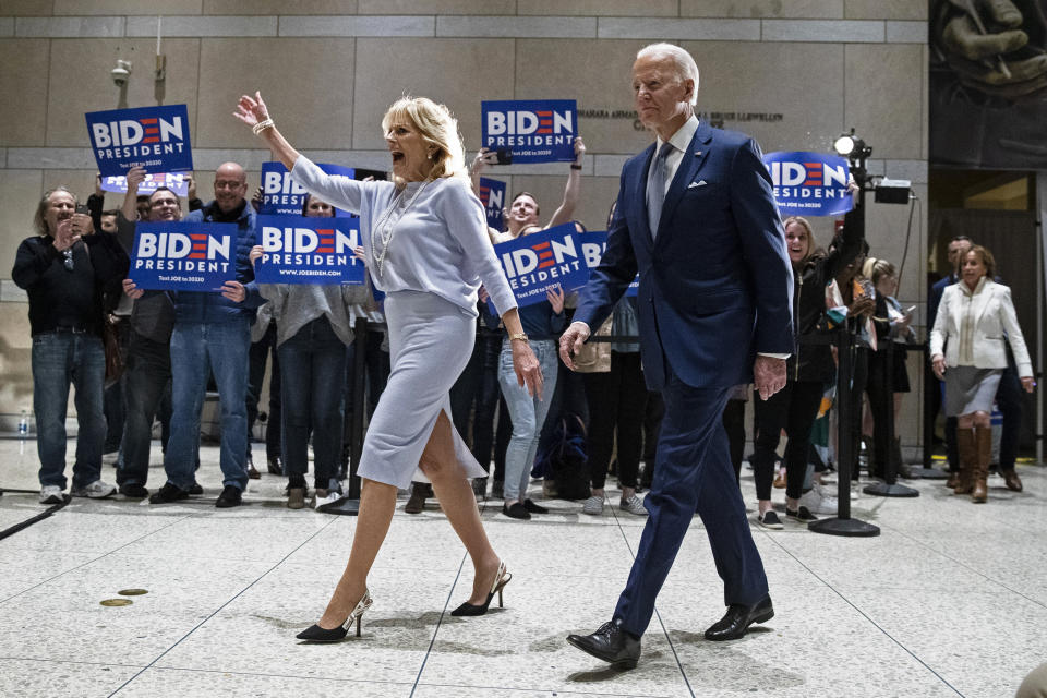 Democratic presidential candidate former Vice President Joe Biden, accompanied by his wife Jill arrives to speak to members of the press at the National Constitution Center in Philadelphia, Tuesday, March 10, 2020. (AP Photo/Matt Rourke)