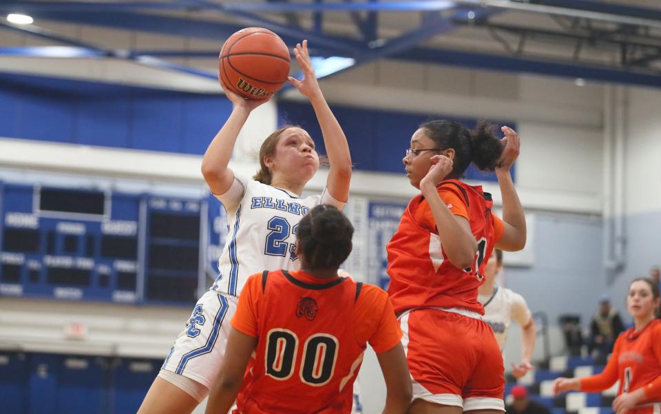 Ellwood CIty's Kayla Jones (23) goes for a layup while being guarded by Beaver Falls Carla Brown (11) and Marque Taylor (00) during the second half Thursday night at Lincoln High School.