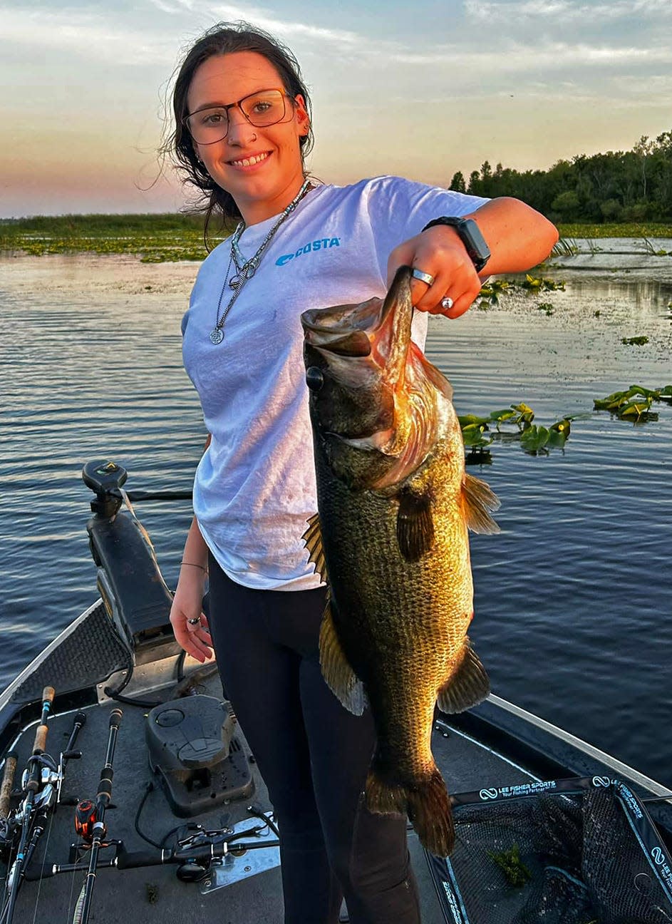 Kiara Kelly, of Lakeland, caught this 7.1-pound largemouth bass on a topwater frog while fishing at Lake Parker on Monday. 