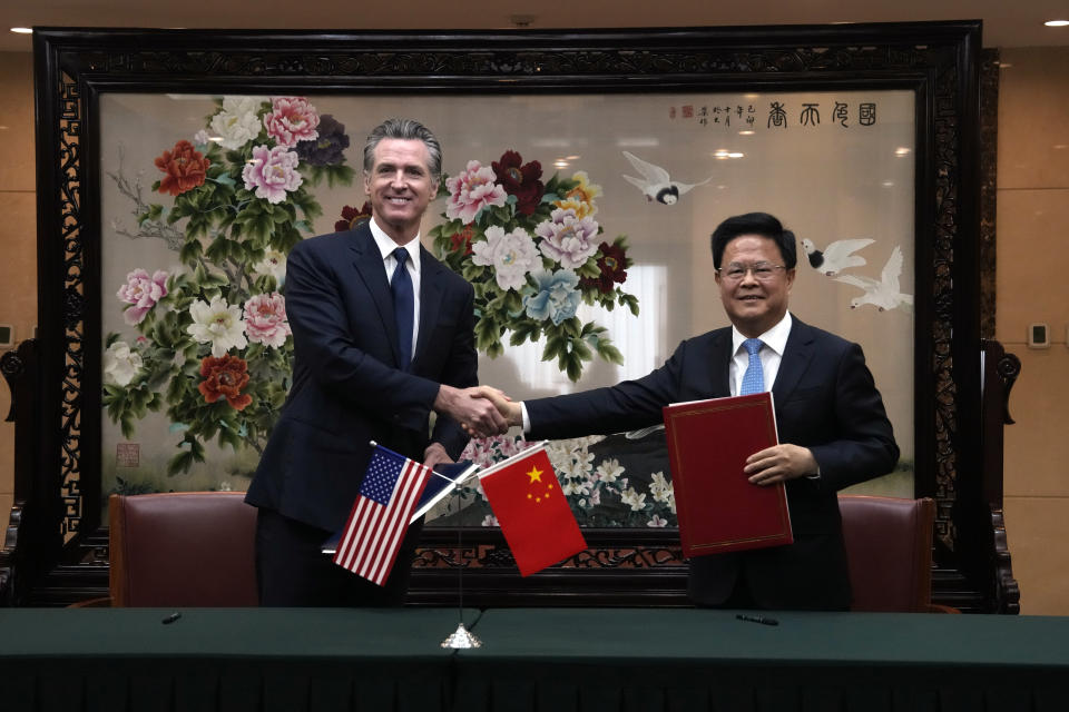 California Gov. Gavin Newsom, left, shakes hands with Zheng Shanjie, head of China's National Development and Reform Commission, after they signed a Memorandum of Understanding in Beijing, Wednesday, Oct. 25, 2023. Newsom also met with China's senior most diplomat Wang Yi on Wednesday and displayed a brief moment of friendliness that stands in sharp contrast to the dialogue between the U.S. and China in recent years. (AP Photo/Ng Han Guan)