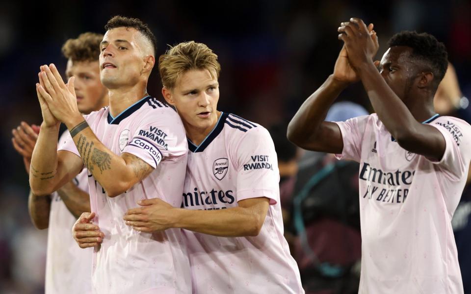 Granit Xhaka, Martin Odegaard and Eddie Nketiah of Arsenal applaud the fans - GETTY IMAGES