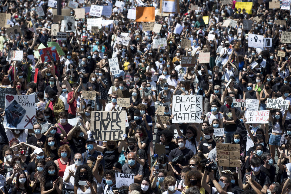 People gather calling for justice for George Floyd in Rome's Piazza del Popolo square, Sunday, June 7, 2020. Floyd died May 25 after being restrained by police in Minneapolis. (Roberto Monaldo/LaPresse via AP)