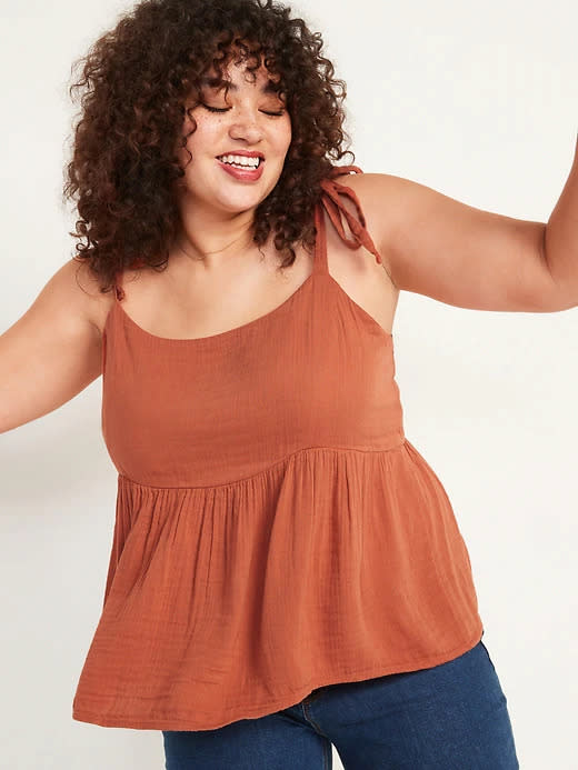 Model wears Tie-Strap Waist-Defined Swing Cami in rust. Image via Old Navy.