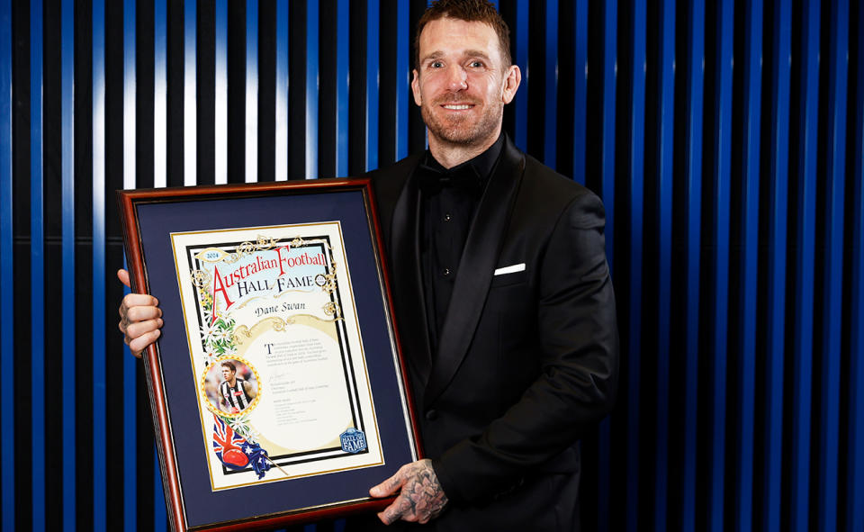 Dane Swan, pictured here with his AFL Hall of Fame certificate. 