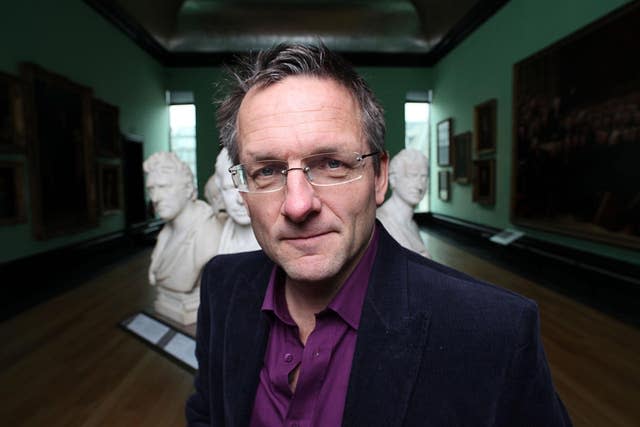 Dr Michael Mosley standing inside a museum