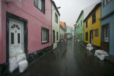 Sandbags are placed outside houses to protect against heavy rains and winds during the passage of hurricane Alex in Ponta Delgada, Azores, Portugal, January 15, 2016. REUTERS/Rui Soares