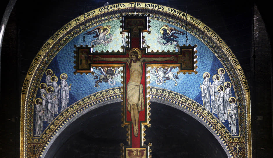 A cross with a painting of Jesus Christ hangs over the alter at Westminster Cathedral.