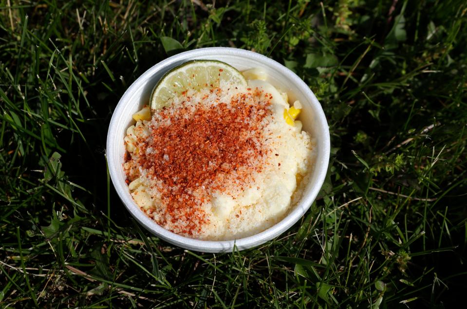Mexican Elote, sweet corn with mayonnaise, cotija, tajin and lime, from Gourmet Corn Yucatán Cuisine.
