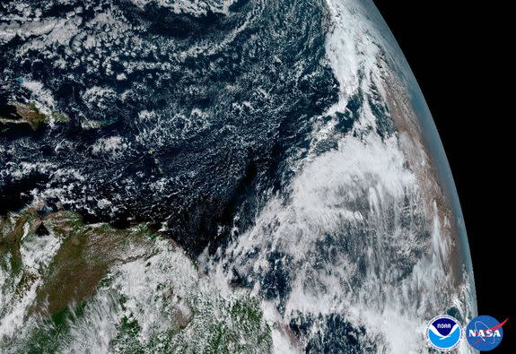 Dust can be seen off the coast of the African continent on the right side of this image.