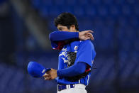 South Korea's Euilee Lee wipes his face during a semi-final baseball game against the United States at the 2020 Summer Olympics, Thursday, Aug. 5, 2021, in Yokohama, Japan. (AP Photo/Sue Ogrocki)