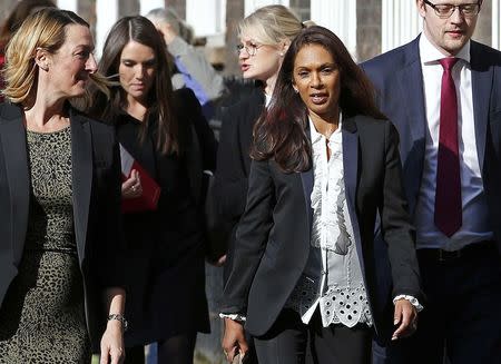 Gina Miller (2nd R) returns to the High Court during a legal challenge to force the British government to seek parliamentary approval before starting the formal process of leaving the European Union, in London, Britain, October 13, 2016. REUTERS/Stringer