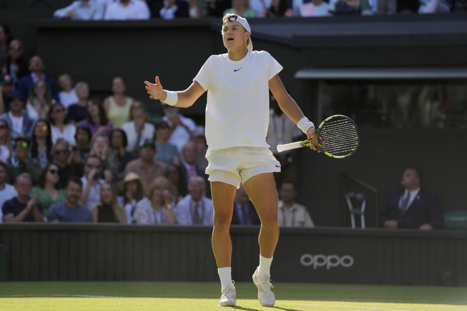 Denmark's Holger Rune reacts after losing a point against Carlos Alcaraz in a men's singles match on day ten of the Wimbledon tennis championships in London, Wednesday, July 12, 2023.(AP Photo/Kirsty Wigglesworth)
