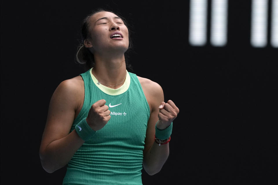 Zheng Qinwen of China celebrates after defeating compatriot Wang Yafan during their third round match at the Australian Open tennis championships at Melbourne Park, Melbourne, Australia, Saturday, Jan. 20, 2024. (AP Photo/Andy Wong)