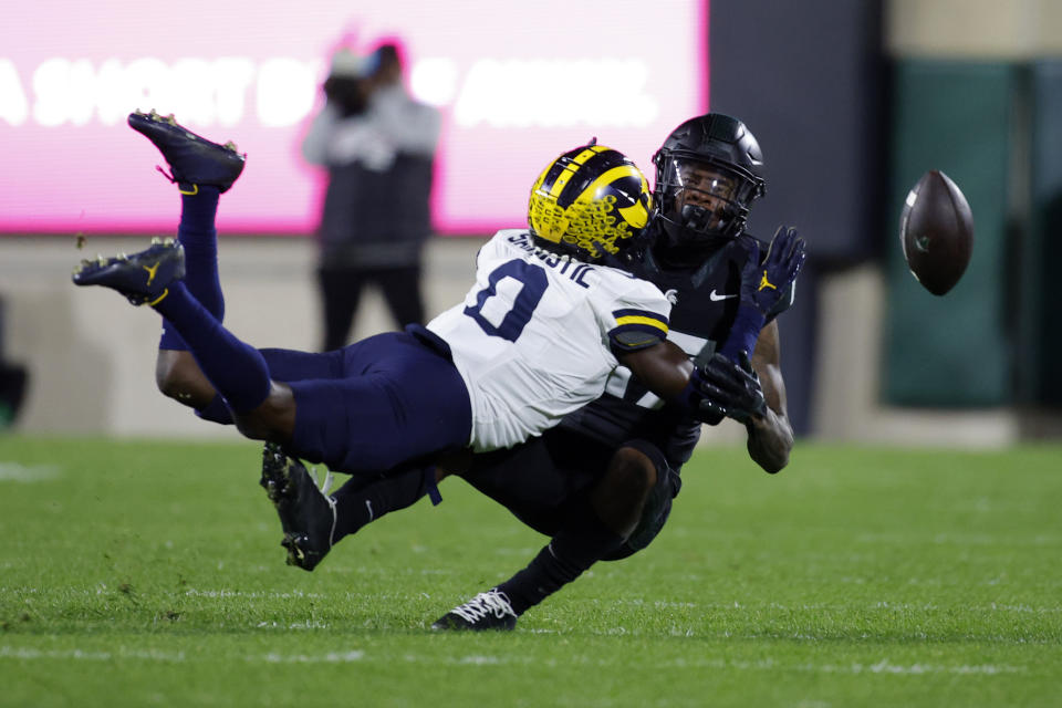 Michigan defensive back Mike Sainristil, left, breaks up a pass intended for Michigan State wide receiver Tre Mosley, right, during the first half of an NCAA college football game, Saturday, Oct. 21, 2023, in East Lansing, Mich. (AP Photo/Al Goldis)
