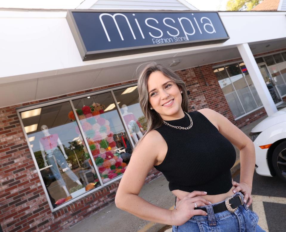 Larissa Dias, owner of Misspia, stands in front of her Washington Street, Stoughton store.