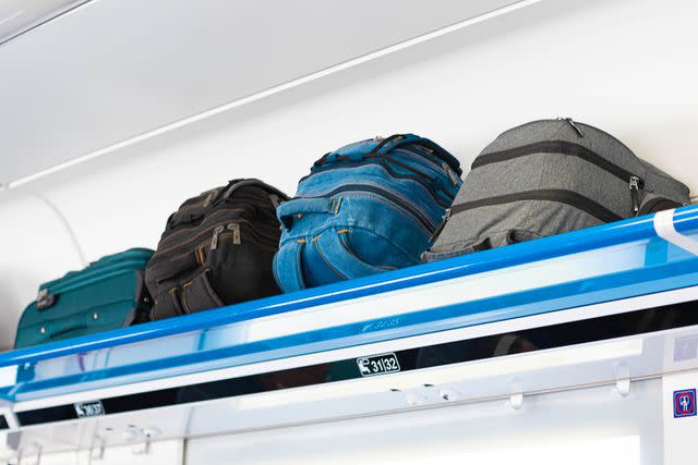 <p>Getty</p> Bags stowed in the overhead compartment