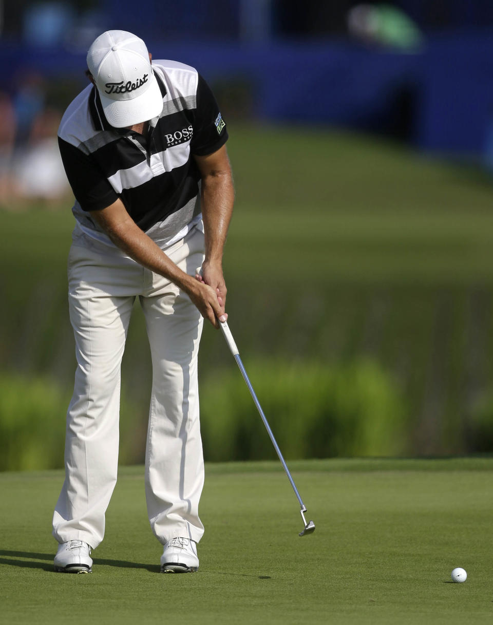 Erik Compton putts on the 18th green during the second round of the Zurich Classic golf tournament at TPC Louisiana in Avondale, La., Friday, April 25, 2014. (AP Photo/Gerald Herbert)