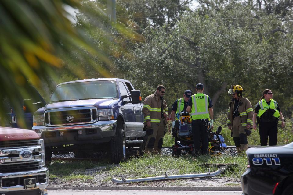 First responders tend to a crash involving a Ford pickup and a mini van near the intersection of 23rd Street and U.S.1 in Vero Beach, Monday, Oct. 2, 2023.