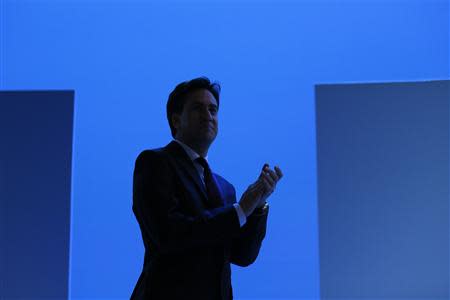 Britain's opposition Labour leader Ed Miliband applauds as he walks on stage at the annual Labour party conference in Brighton, southern England September 22, 2013. REUTERS/Stefan Wermuth