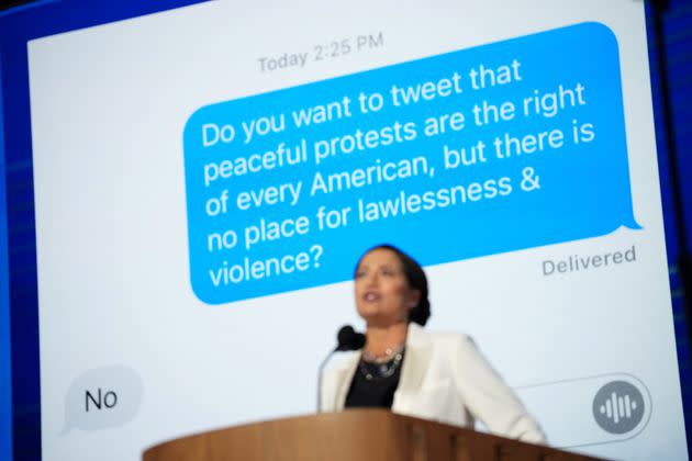 Stephanie Grisham speaks at the Democratic National Convention in front of a screenshot of a text she said she sent to Melania Trump.