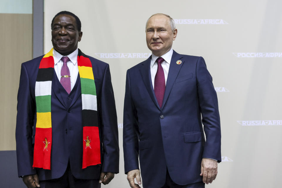 Russian President Vladimir Putin, right, and the President of the Republic of Zimbabwe, Emmerson Dambudzo Mnangagwa, pose for a photo on the sideline of the Russia Africa Summit in St. Petersburg, Russia, Thursday, July 27, 2023. (Mikhail Metzel/TASS Host Photo Agency Pool Photo via AP)